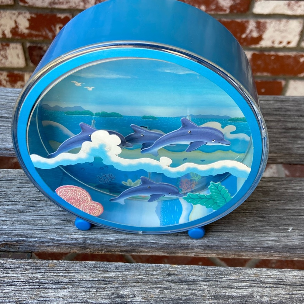 Vintage Ishiguro over the waves dolphins music box